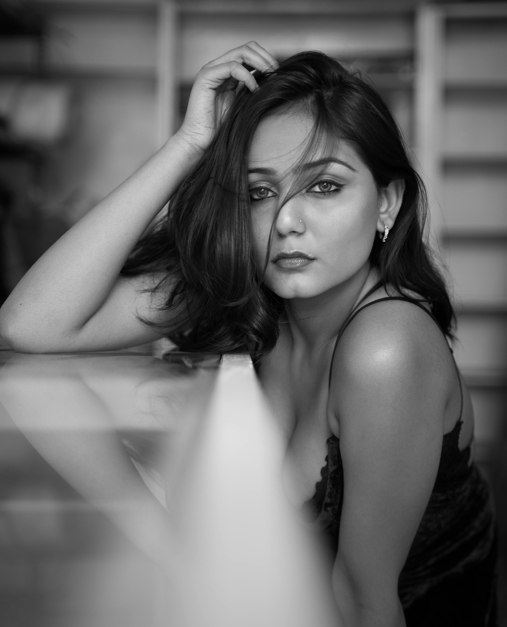 Striking grayscale portrait of a woman in Noida, India, displaying elegance and introspection.